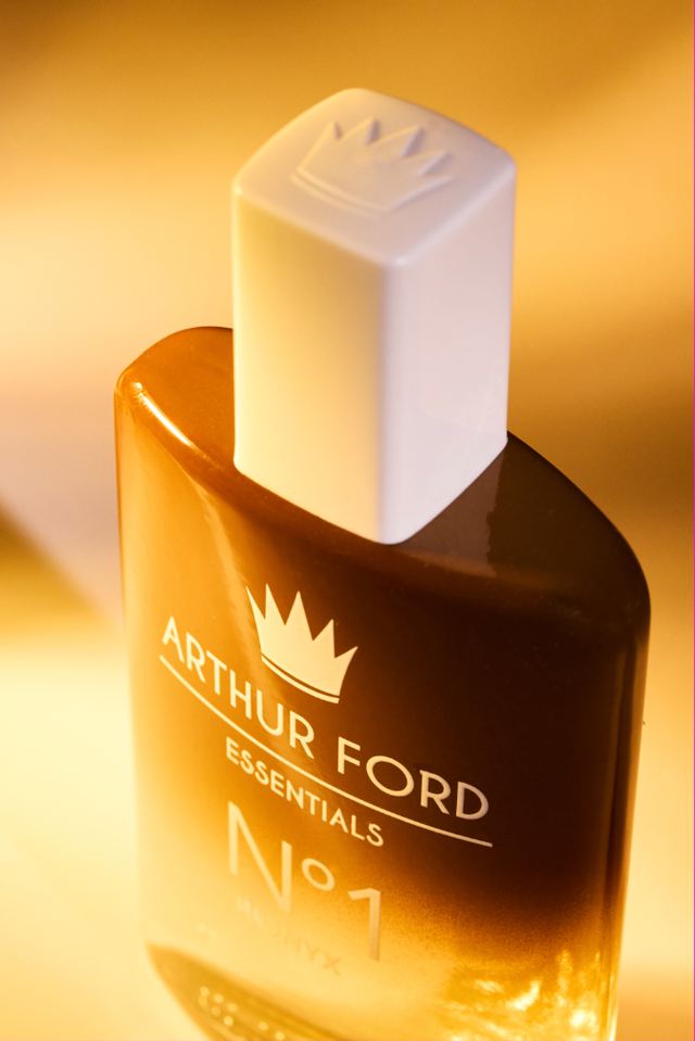 Amber Essentials N°1 bottle with crown cap in warm light