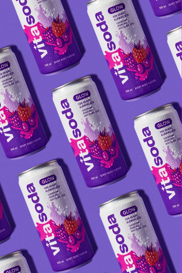 Rows of Vita Soda cans on a purple background